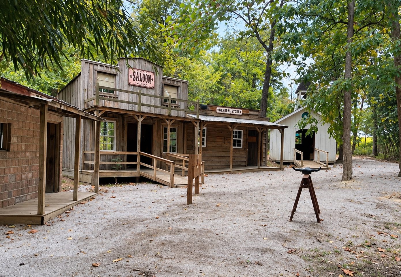 Frontier Town’s Old West street: the jail, Saloon, General Store and white church, with a steer-head roping target out front